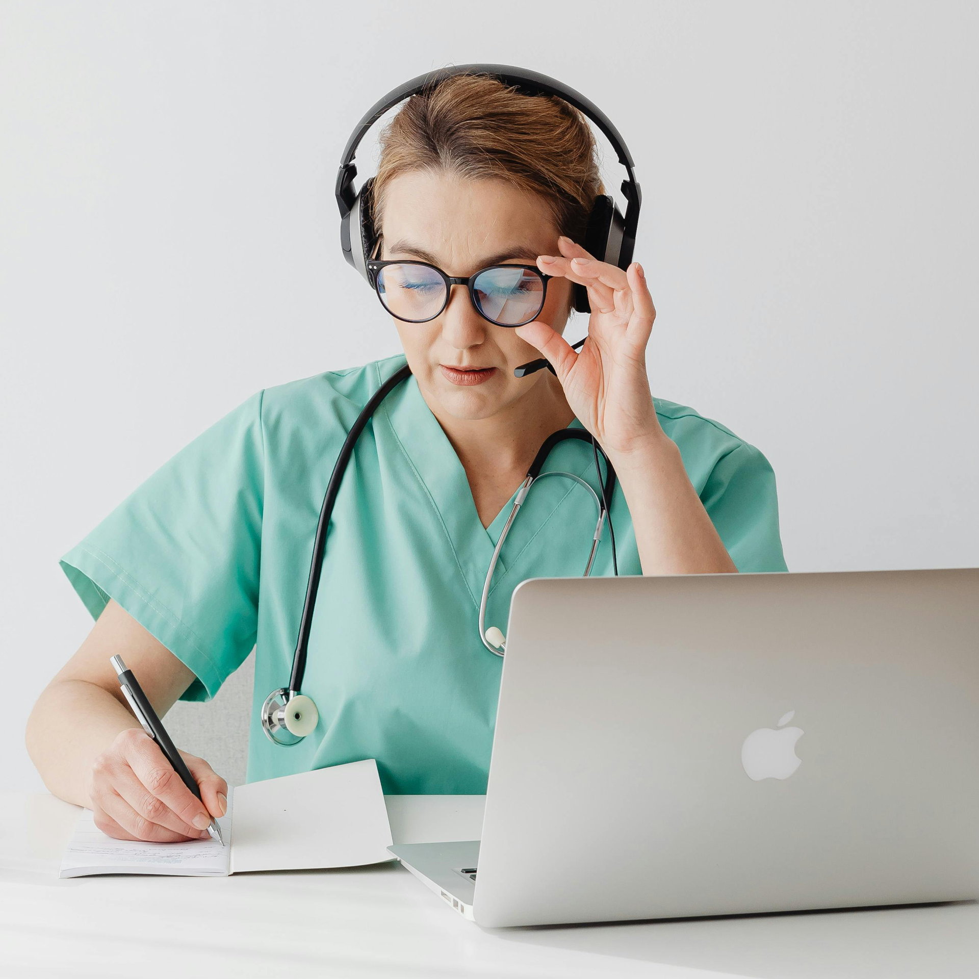 Doctor with tablet reviewing patient information